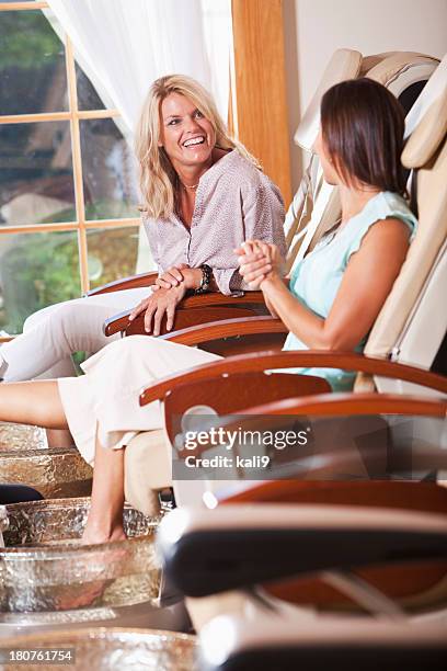 women getting pedicures - pedicure stock pictures, royalty-free photos & images