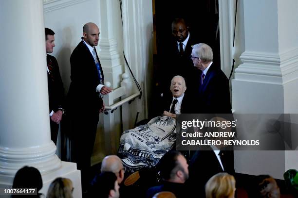 Former US President Jimmy Carter arrives for a tribute service for former US First Lady Rosalynn Carter, at Glenn Memorial Church in Atlanta,...