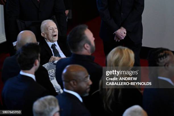 Former US President Jimmy Carter arrives for a tribute service for former US First Lady Rosalynn Carter, at Glenn Memorial Church in Atlanta,...