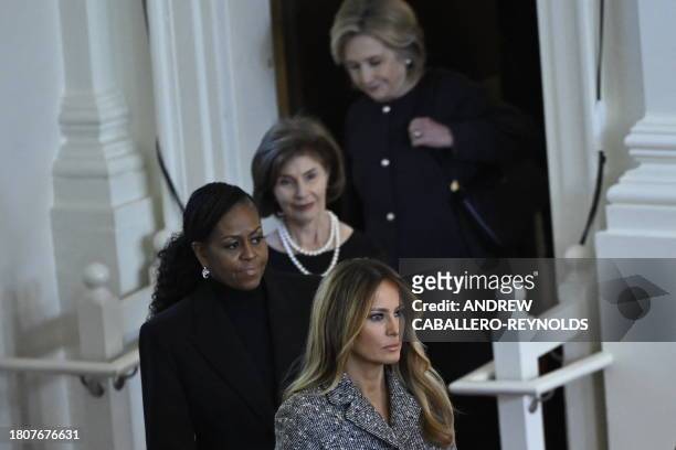 Former US Secretary of State Hillary Clinton, former US First Lady Laura Bush, former US First Lady Michelle Obama, and former US First Lady Melania...