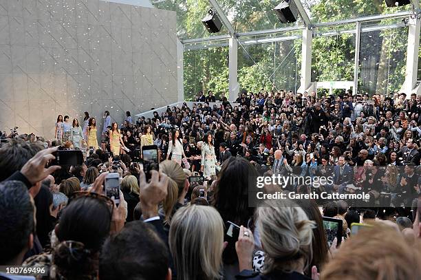 Models walk the runway for the finale at Burberry Prorsum Womenswear Spring/Summer 2014 show during London Fashion Week at Kensington Gardens on...