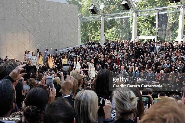 Models walk the runway for the finale at Burberry Prorsum Womenswear Spring/Summer 2014 show during London Fashion Week at Kensington Gardens on...