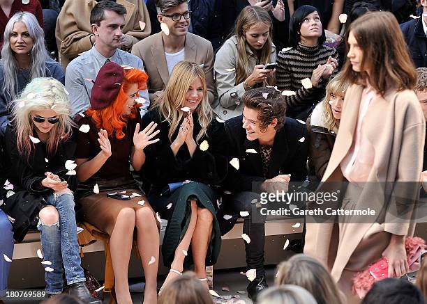Alison Mosshart, Paloma Faith, Sienna Miller, Harry Styles and Suki Waterhouse sit in the front row at Burberry Prorsum Womenswear Spring/Summer 2014...
