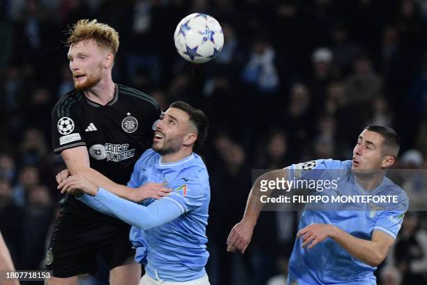 Lazio's Spanish defender Mario Gila Fuentes fights for the ball with Celtic's Irish defender Liam Scales during the UEFA Champions League Group E...
