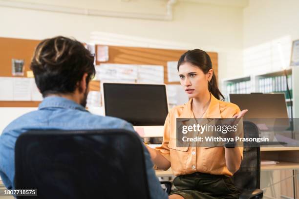boss denies something to upset employee in her office - respektlosigkeit stock-fotos und bilder