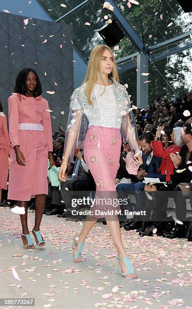 Cara Delevingne walks the runway at the front row at Burberry Prorsum Womenswear Spring/Summer 2014 show during London Fashion Week at Kensington...