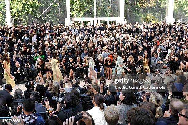 Models walk the runway during the finale at Burberry Prorsum Womenswear Spring/Summer 2014 show during London Fashion Week at Kensington Gardens on...