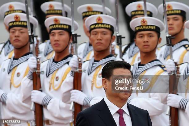 Chinese People's Liberation Army navy soldiers of a guard of honor look at Chinese President Xi Jinping during a welcoming ceremony for King Hamad...