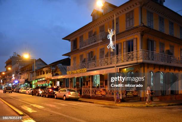 maison thémire at dusk - bar des palmistes, cayenne, french guiana - french guiana stock pictures, royalty-free photos & images