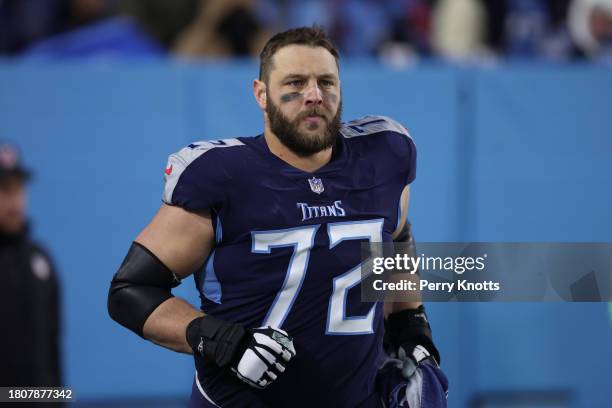 David Quessenberry of the Tennessee Titans stands on the sideline during the AFC Divisional Round playoff game against the Cincinnati Bengals at...