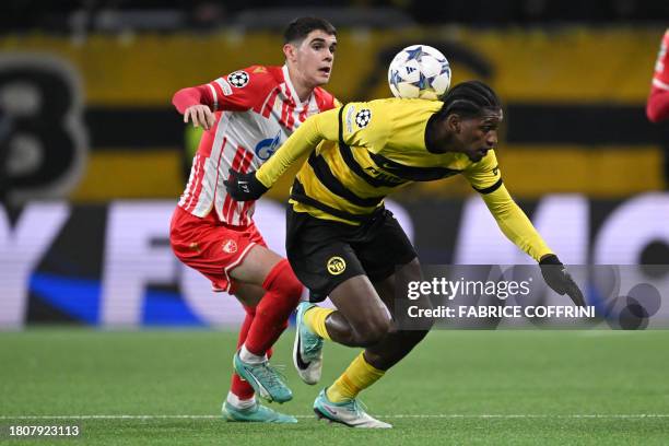 Red Star Belgrade's Serbian defender Kosta Nedeljkovic and Young Boys' Portugese forward Joel Monteiro fight for the ball during the UEFA Champions...
