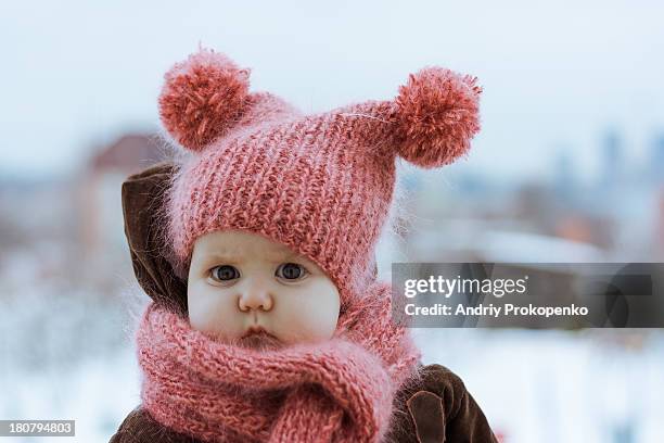 little girl wearing a pink knitted hat and scarf - girl scarf bildbanksfoton och bilder