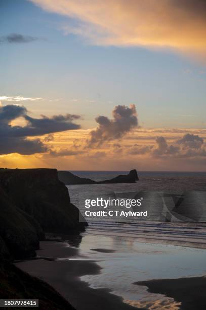 rhossili bay sunset gower - rhossili bay stock pictures, royalty-free photos & images