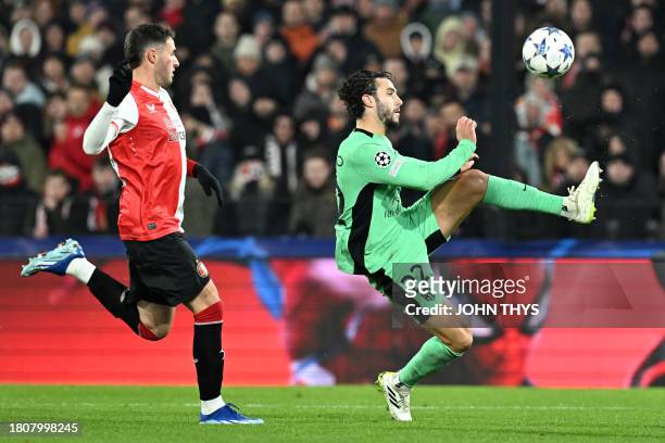 Atletico Madrid's Spanish defender Mario Hermoso kicks the ball and scores his team's second goal during the UEFA Champions League Group E football...