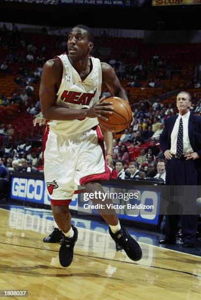 Eddie Jones of the Miami Heat drives against the New Orleans Hornets during the game at American Airlines Arena on February 11, 2003 in Miami,...