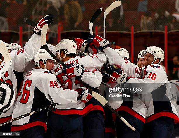 Joel Rechlicz of the Washington Capitals is surrounded by teammates after he scored the game winning goal in a shoot out against the Philadelphia...