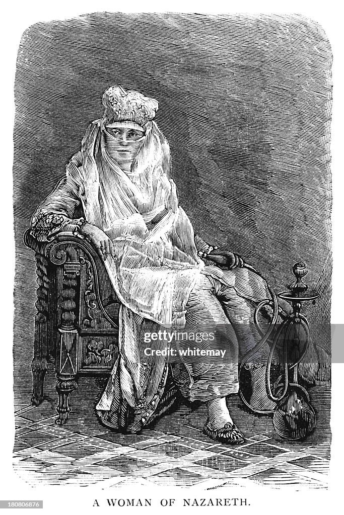 Veiled Middle Eastern woman holding a hookah pipe