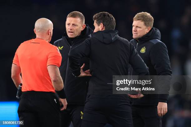 Eddie Howe manager of Newcastle United and his coaching staff confront the referee after the UEFA Champions League match between Paris Saint-Germain...