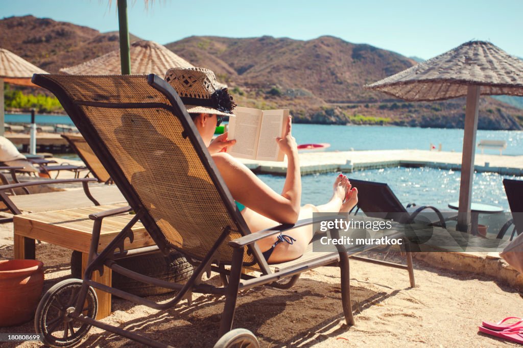 Relaxing and reading on the beach