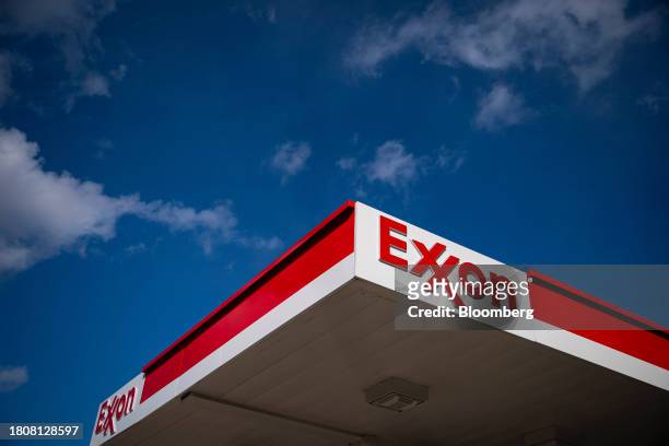An Exxon Mobil gas station in Washington, DC, US, on Tuesday, Nov. 28, 203. Gasoline prices have fallen for 60 consecutive days, the longest streak...