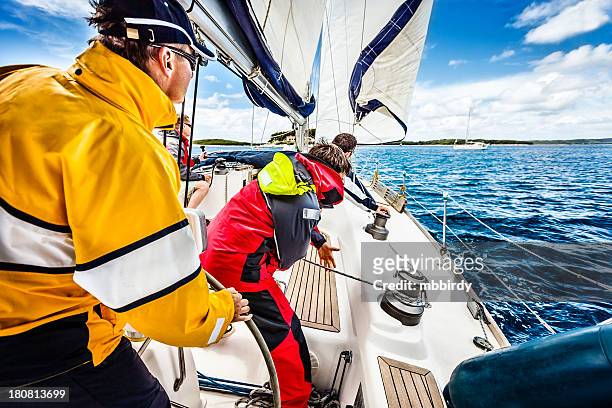 sailing crew beating to windward on sailboat - crew stock pictures, royalty-free photos & images