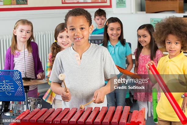 children in music class - percussion instrument stock pictures, royalty-free photos & images