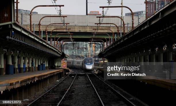 An Amtrak train arrives at Union Station on November 22, 2023 in Washington, DC. Flights, highways, trains, and other forms of transportation are...