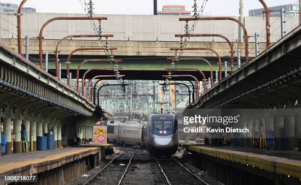 An Amtrak train arrives at Union Station on November 22, 2023 in Washington, DC. Flights, highways, trains, and other forms of transportation are...