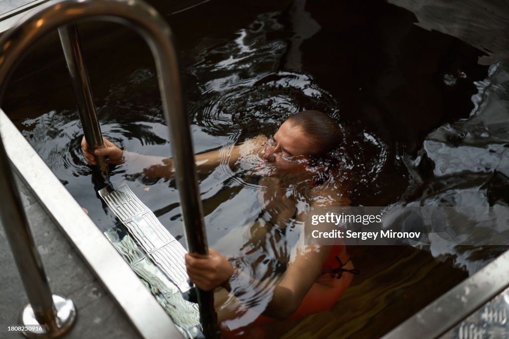 Woman sitting in hot tub