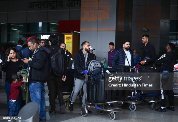 Passengers seen outside the Arrival of Terminal 3 of Indira Gandhi International Airport after some flights gets delayed due to thunderstorm in Delhi...