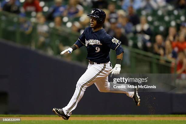 Jean Segura of the Milwaukee Brewers runs to second base after hitting a double, scoring Yuniesky Betancourt in the bottom of the sixth inning...