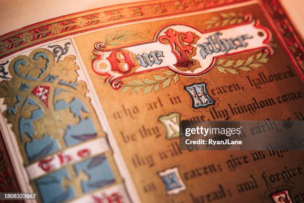 ancient bible pages showing the lord's prayer - old books stock pictures, royalty-free photos & images