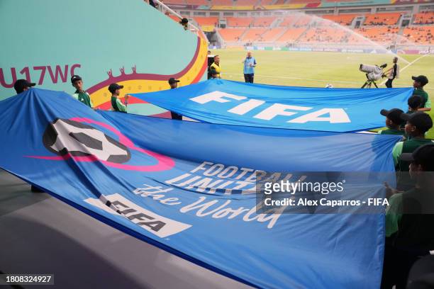 The FIFA flag and the Football Unites The World flag are seen prior to the FIFA U-17 World Cup Group C match between England and IR Iran at Jakarta...