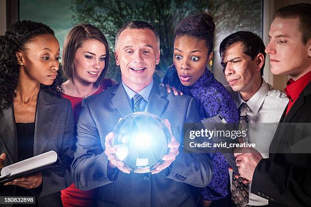 business team with crystal ball - glass ball stock pictures, royalty-free photos & images