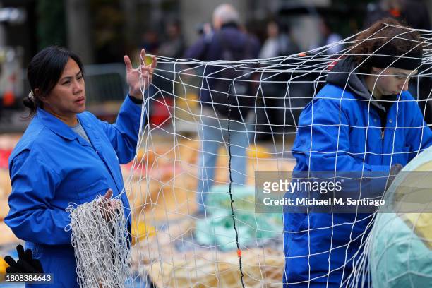 Workers prepare balloons for inflation for the Macy's Thanksgiving Day Parade on November 22, 2023 in New York City. The 97th Macy's Thanksgiving Day...