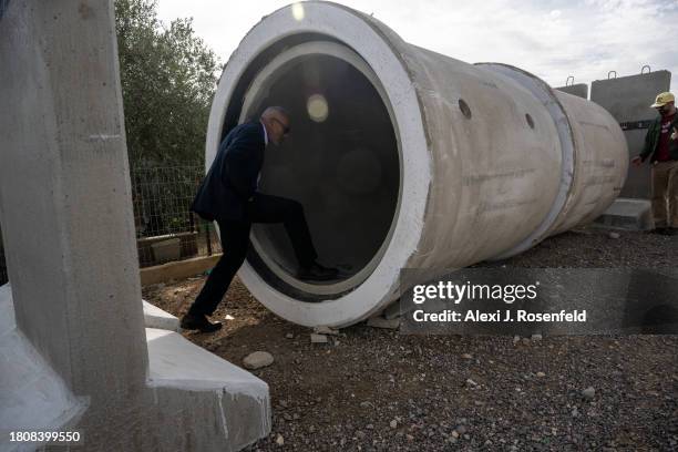 People look inside a temporary concrete bomb shelter in the unrecognized Bedouin village on November 22, 2023 in El Bhat Al Rabi, Israel. On October...