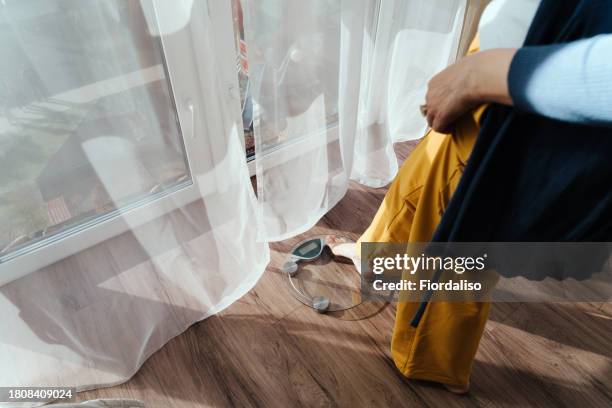 a middle-aged woman standing in the morning on the scales - hormone stock pictures, royalty-free photos & images
