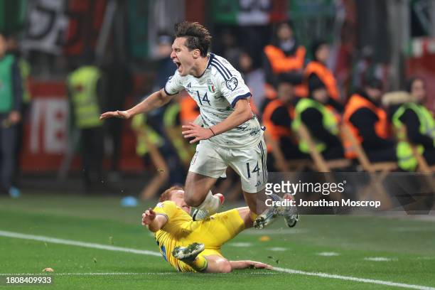 Federico Chiesa of Italy is fouled by Yukhym Konoplia of Ukraine during the UEFA EURO 2024 European qualifier match between Ukraine and Italy at...