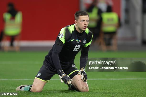 Anatoliy Trubin of Ukraine looks on whilst on his knees during the UEFA EURO 2024 European qualifier match between Ukraine and Italy at BayArena on...