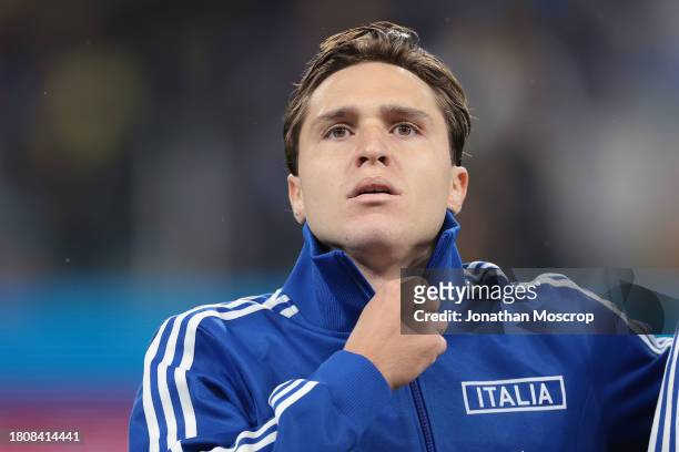 Federico Chiesa of Italy adjusts his zip as he looks on during the line up prior to the UEFA EURO 2024 European qualifier match between Ukraine and...