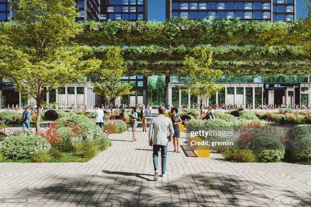 Group of business people walking in city park
