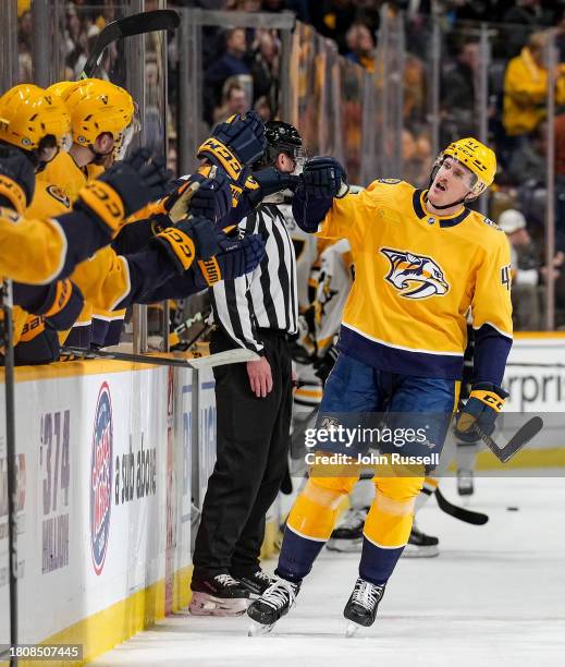 Michael McCarron of the Nashville Predators celebrates his goal against the Pittsburgh Penguins during an NHL game at Bridgestone Arena on November...