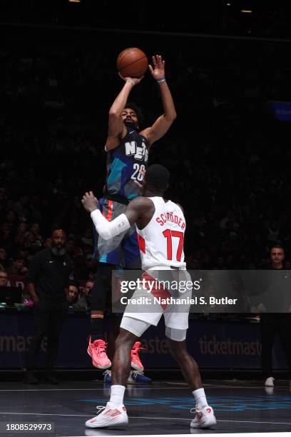 Spencer Dinwiddie of the Brooklyn Nets shoots a three point basket against the Toronto Raptors during the In-Season Tournament on November 28, 2023...