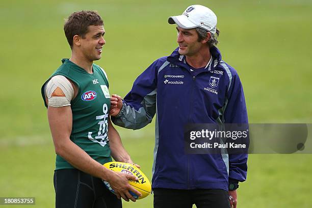 Assistant coach Brett Kirk talks with Stephen Hill during a Fremantle Dockers AFL training session at Fremantle Oval on September 17, 2013 in...