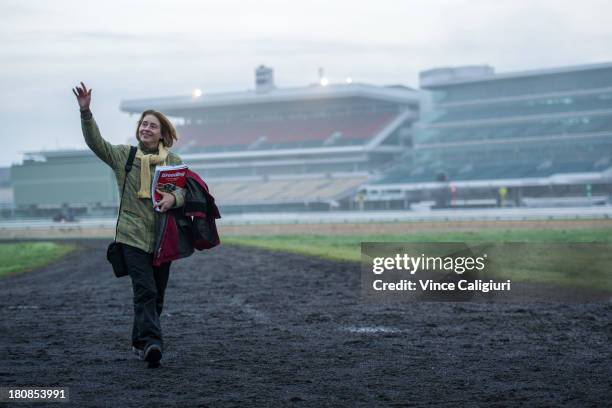 Trainer Gai Waterhouse waves goodbye to other trainers as she leaves a trackwork session at Flemington Racecourse on September 17, 2013 in Melbourne,...