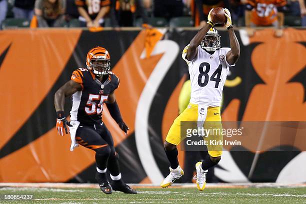 Antonio Brown of the Pittsburgh Steelers catches a pass in front of Vontaze Burfict of the Cincinnati Bengals during the fourth quarter on September...