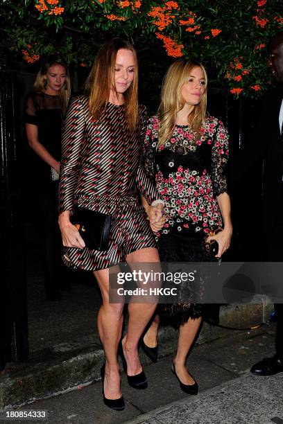 Stella McCartney and Sienna Miller attend an evening to celebrate The Global Fund hosted by the Earl and Countess of Mornington, Anna Wintour, Livia...