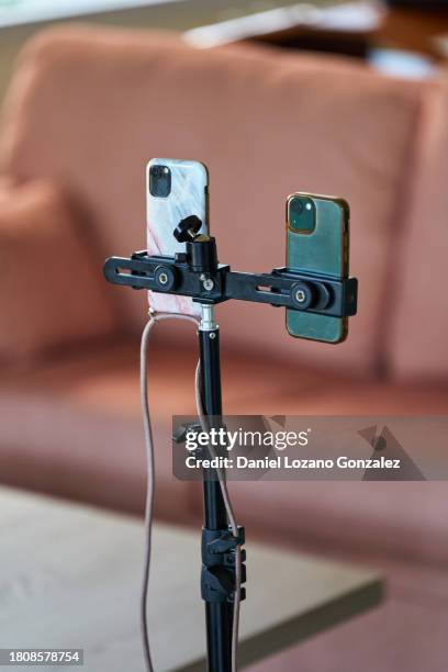 set of smartphones on mobile phone holder taking pictures - room service stock pictures, royalty-free photos & images