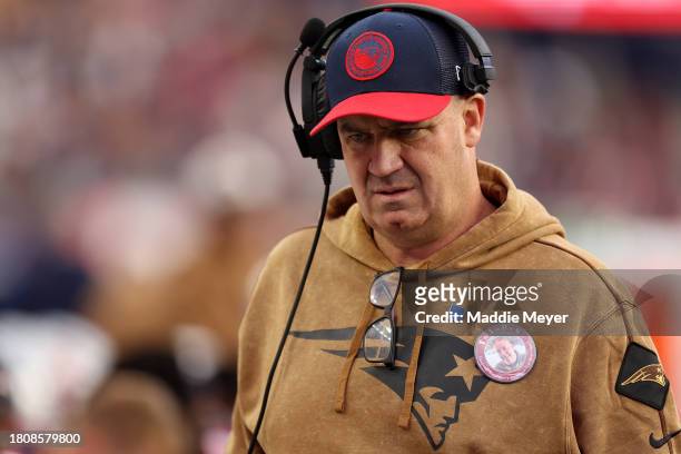 New England Patriots Offensive Coordinator Bill O'Brien looks on from the bench during the game against the Washington Commanders at Gillette Stadium...