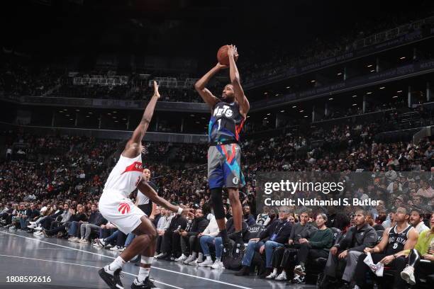 Mikal Bridges of the Brooklyn Nets shoots a three point basket against the Toronto Raptors during the In-Season Tournament on November 28, 2023 at...